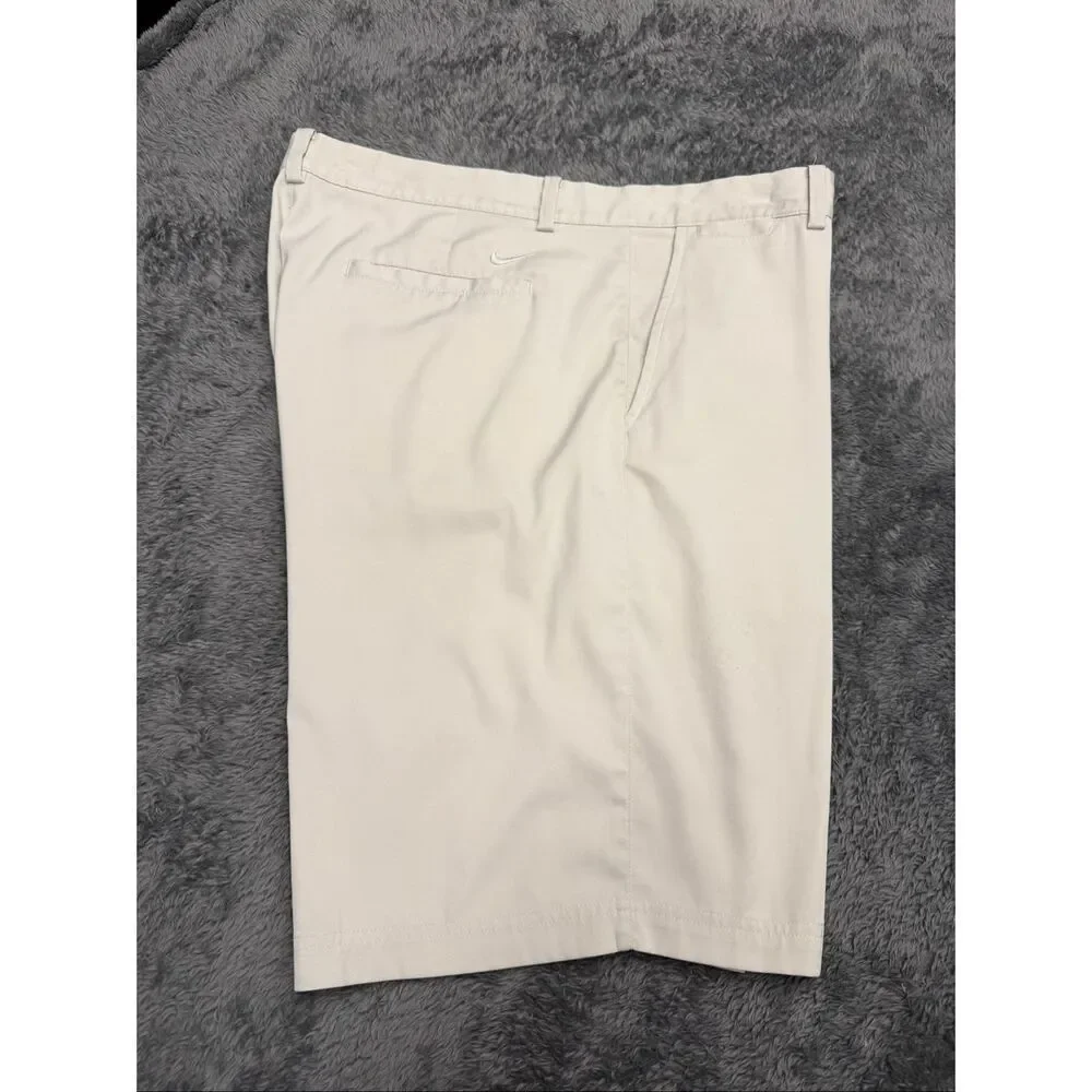 Nike Golf Tour Performance Khaki Shorts, Size Men’s 38. Color is beige.